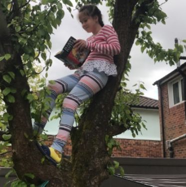 Maria P reading in bizarre place